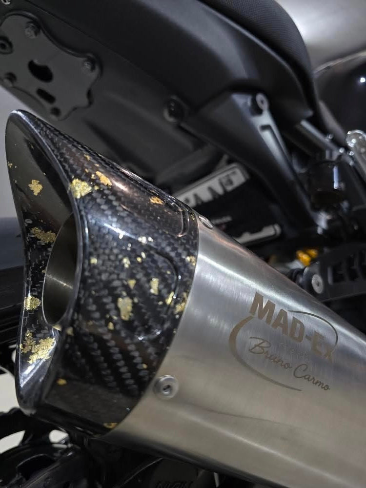 Close-up of the MAD-Ex carbon end cap with Bruno Carmo engraving on the stainless steel silencer
