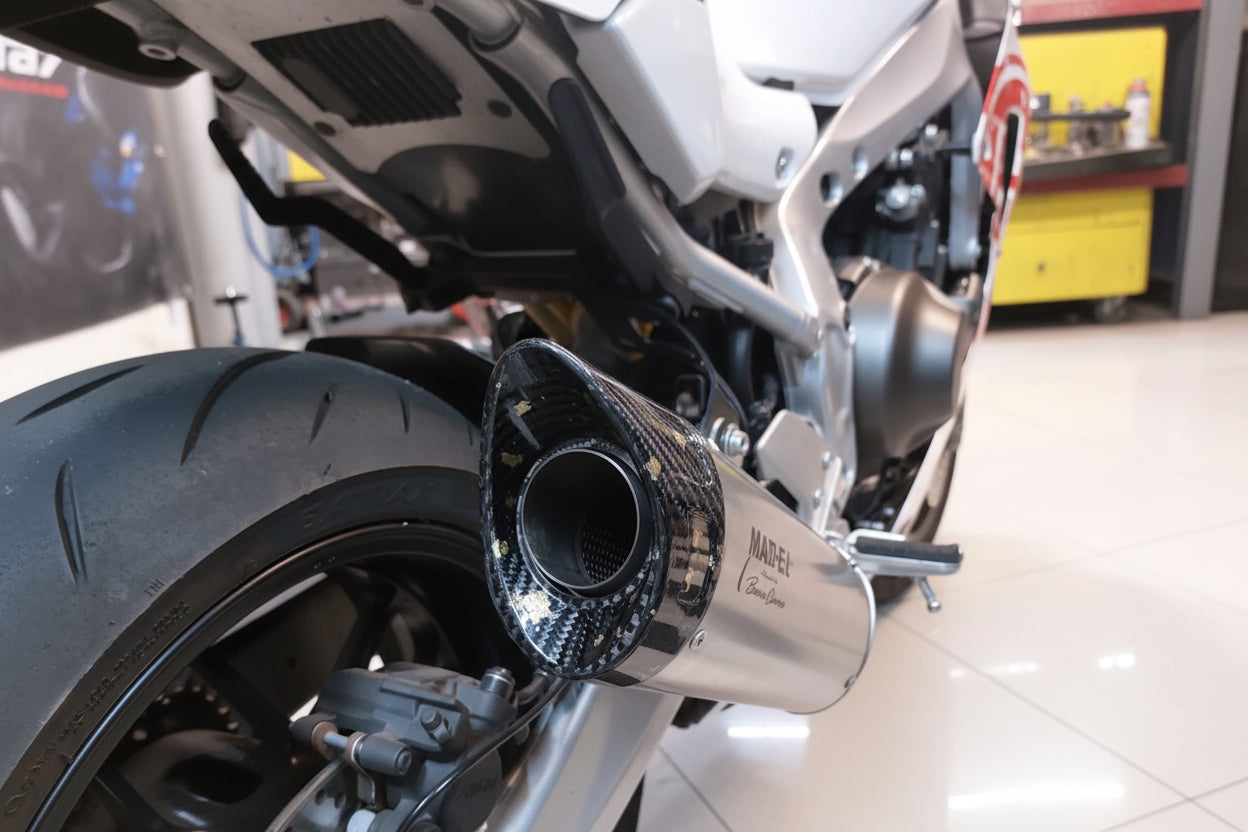 Carbon end cap of the MAD-Ex silencer on the Yamaha XSR900 GP, rear three-quarter view of the exhaust outlet