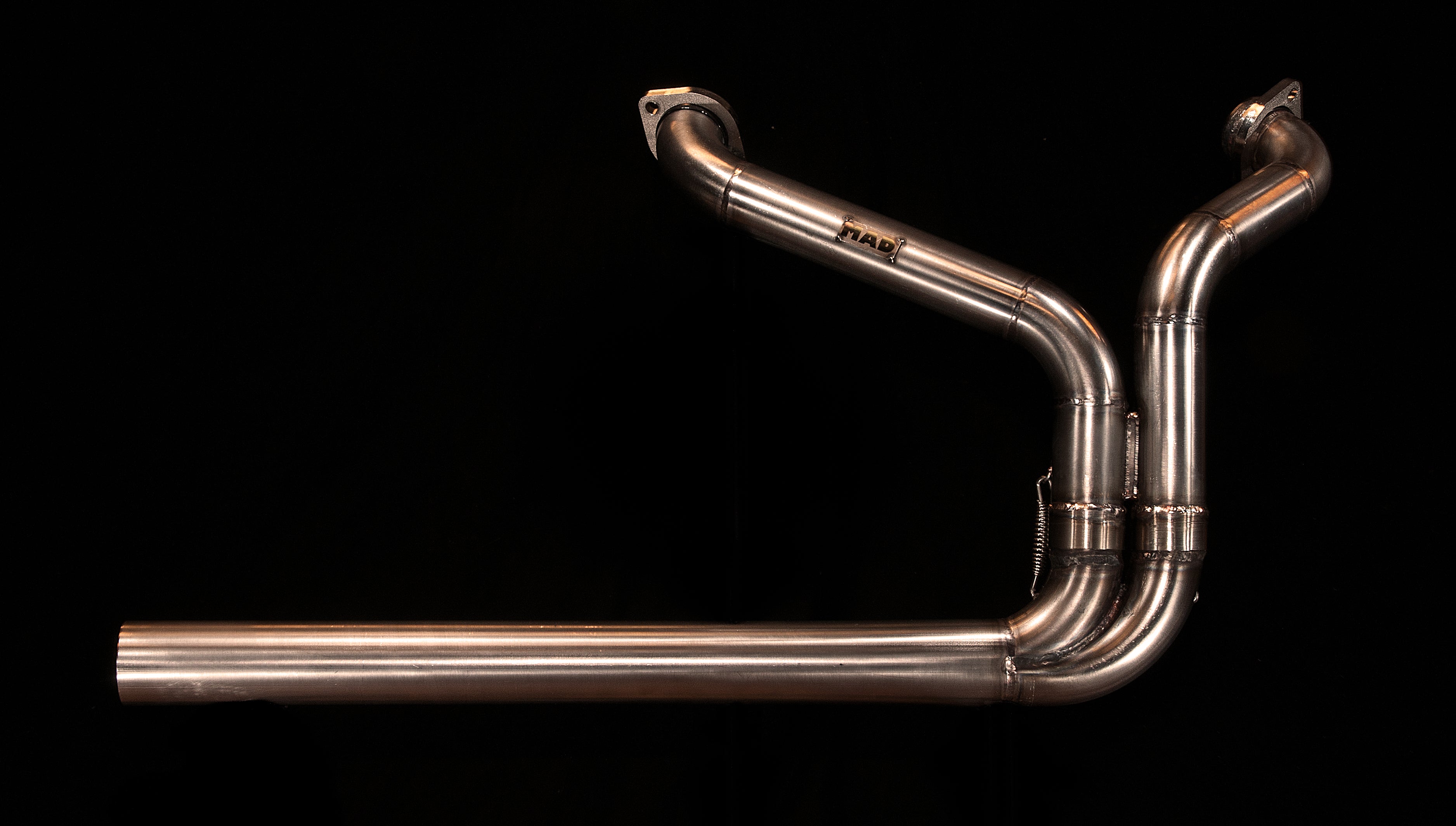 MAD Exhausts Harley-Davidson Sportster 2-in-1 stainless steel exhaust system with MAD logo, studio photo on black