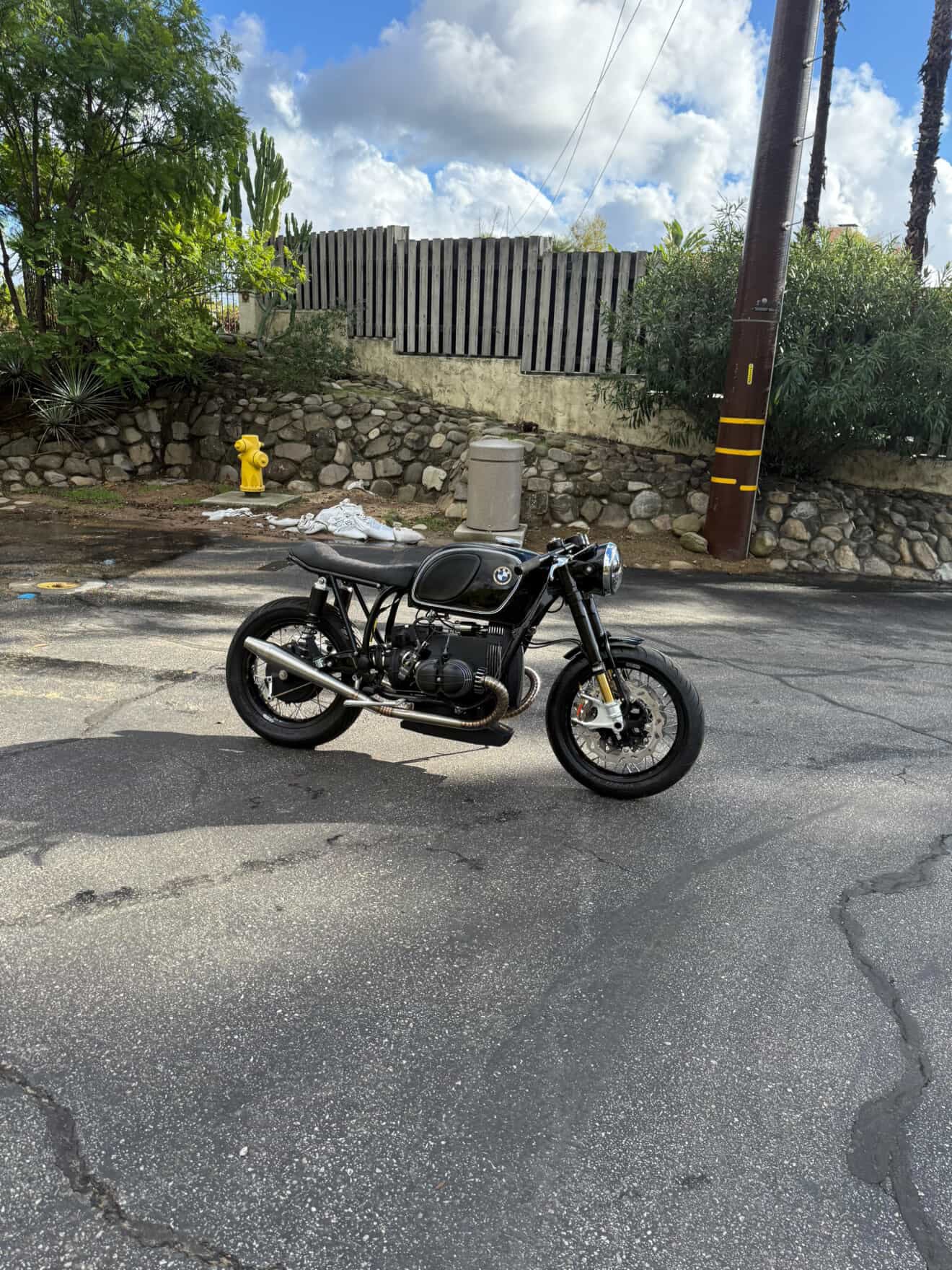 Left-side profile of the BMW airhead cafe racer with the MAD Exhausts cone muffler, street setting
