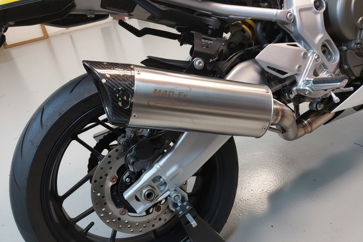 MAD-Ex end silencer mounted low on the Yamaha XSR900 GP, side view above the rear wheel and brake disc