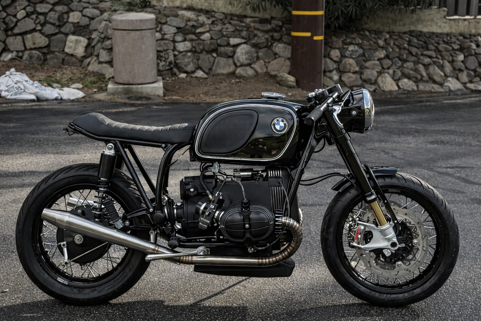 Black BMW airhead cafe racer (MAD x Roughchild build) fitted with the MAD Exhausts stainless steel system, full left-side view