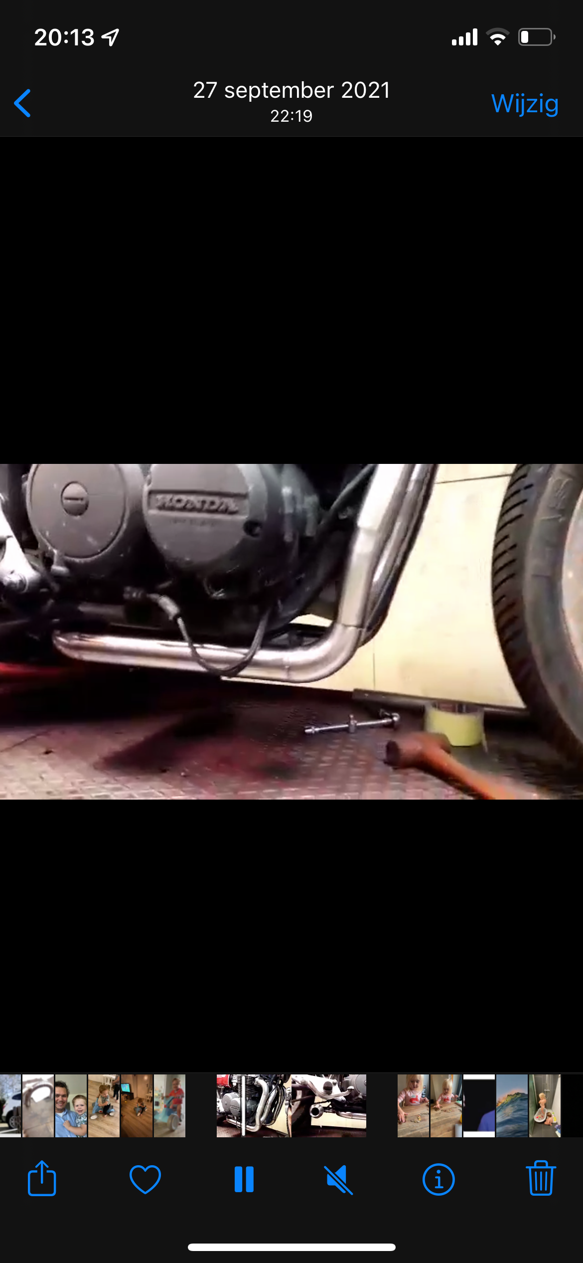 Phone screenshot of the MAD Exhausts Cobra system mounted under a Honda CB750, side angle